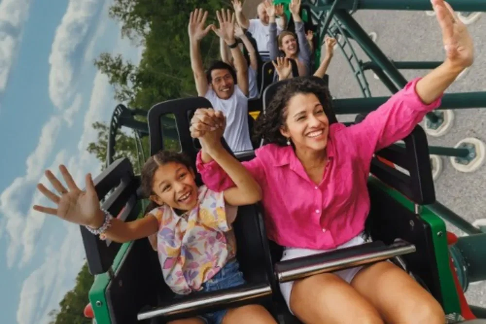 LEGOLAND New York Adds FIFA World Cup 2026 Experience This Summer 2 A parent and child riding The Dragon coaster at LEGOLAND New York