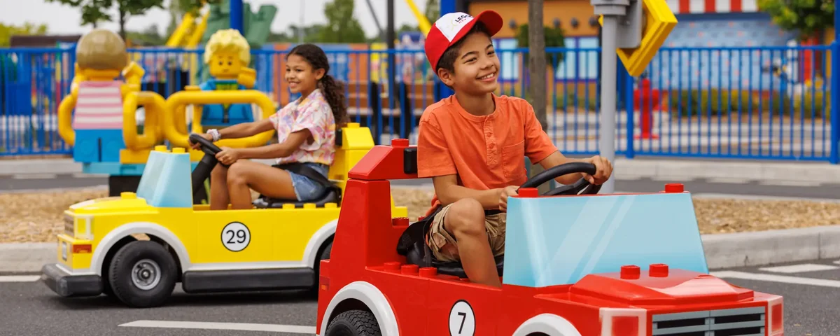 Children riding LEGO cars at LEGOLAND New York Driving School