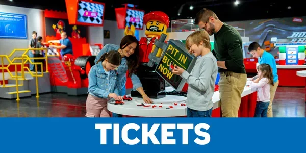 Official LEGOLAND New York tickets graphic with a family in an indoor attraction