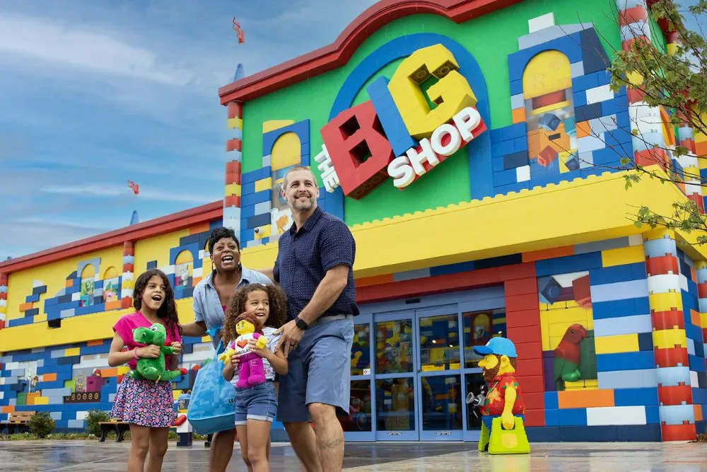 Brick Street at LEGOLAND New York: Rides, Shops, Food & Tips 11 Family shopping inside The BIG Shop at LEGOLAND New York