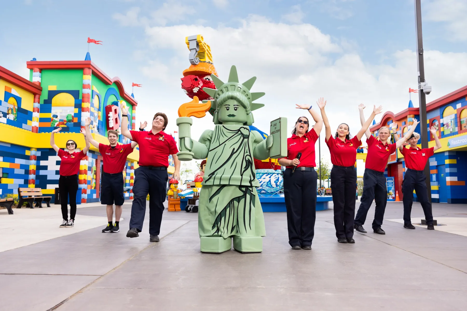 Brick Street at LEGOLAND New York: Rides, Shops, Food & Tips 21 Lady Liberty posing with Model Citizens on Brick Street