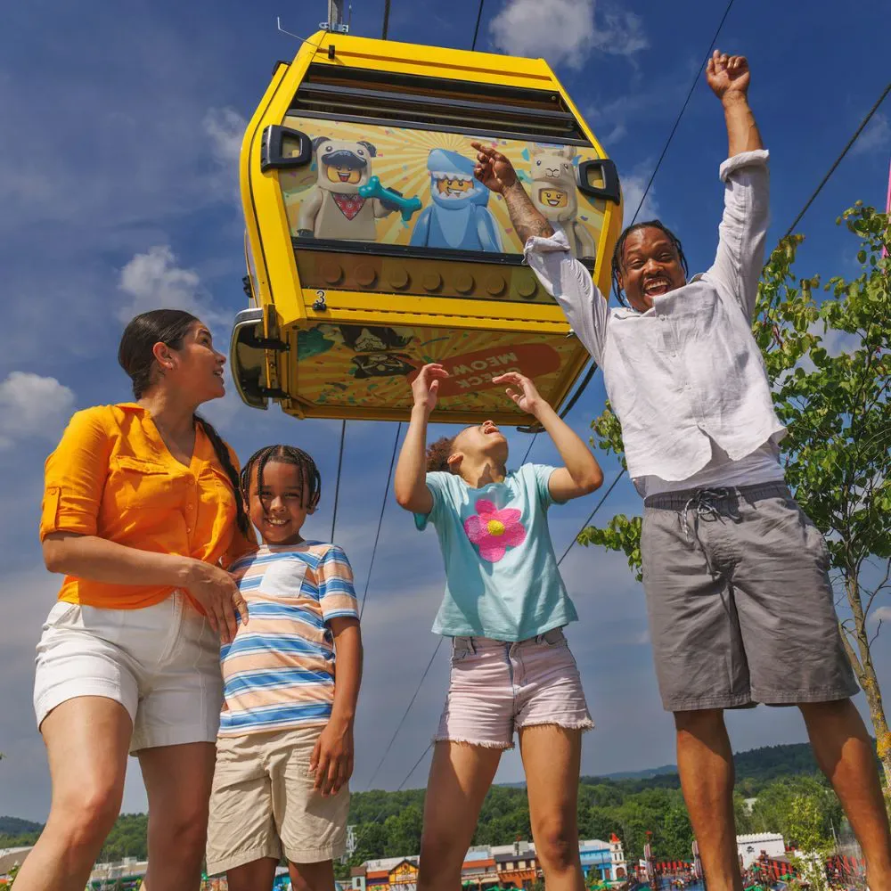 Brick Street at LEGOLAND New York: Rides, Shops, Food & Tips 5 Family in front of Minifigure Skyflyer at LEGOLAND New York