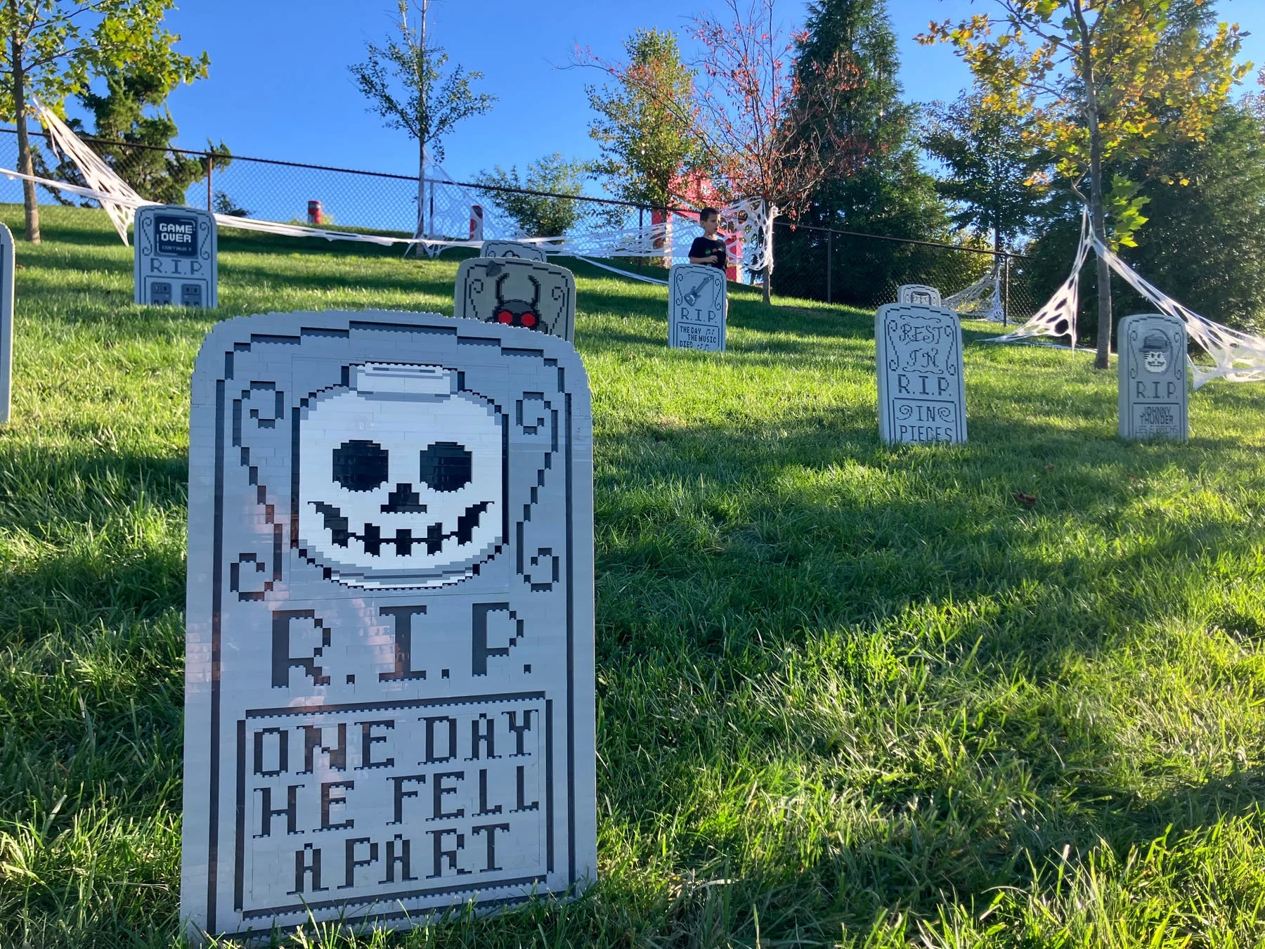 LEGO skeleton tombstone in the Graveyard Ghouls area at LEGOLAND New York